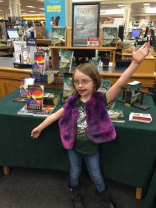 Eowyn bringing attention to my books display            