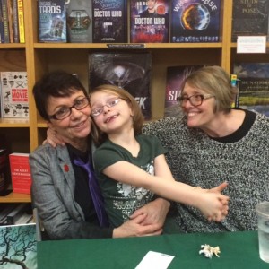 Granddaughter with my wife and me